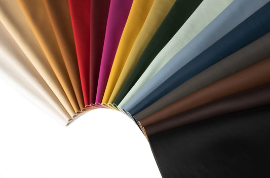 Fan of marine-grade leather samples in a full colour range, showing grain and finish variation