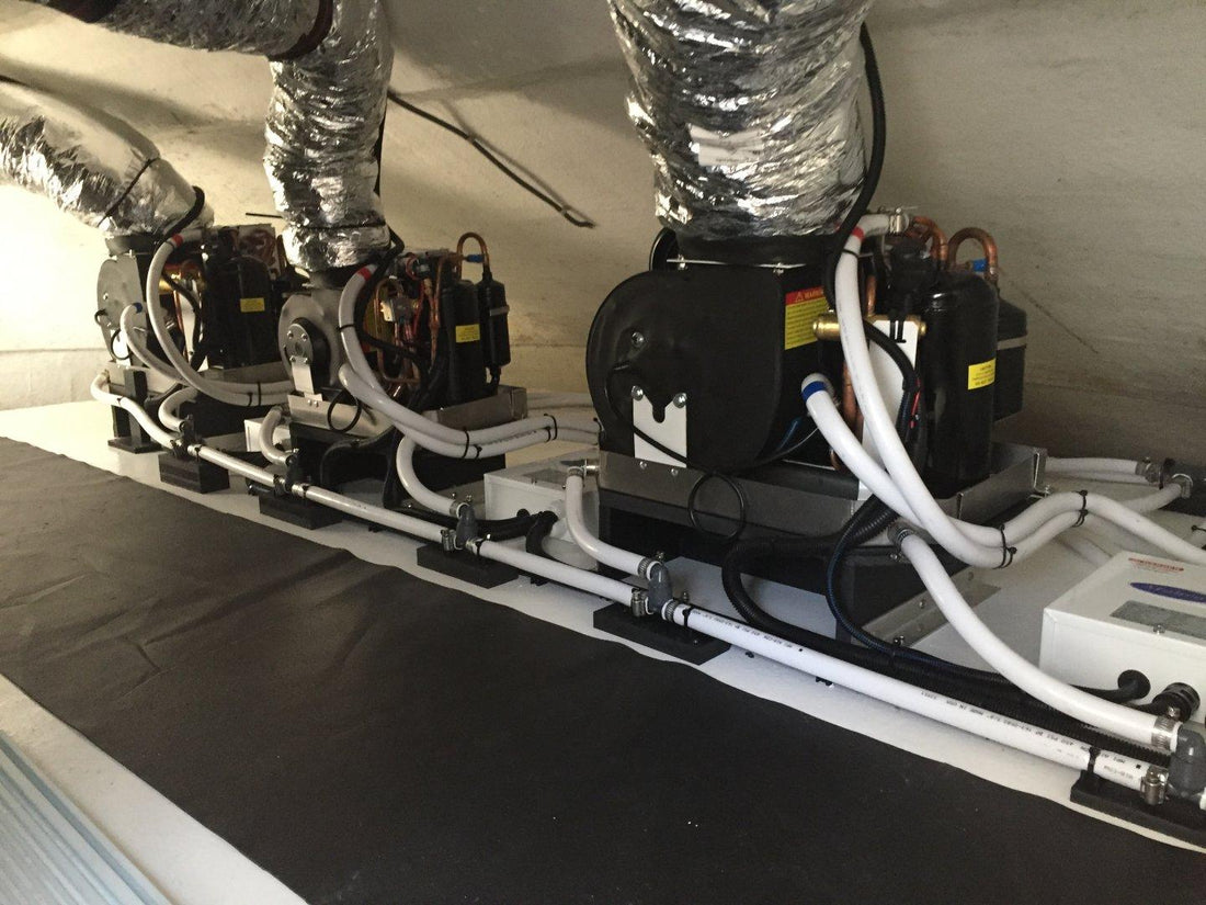 Bank of marine air conditioning compressor units with insulated ducting installed in a technical space