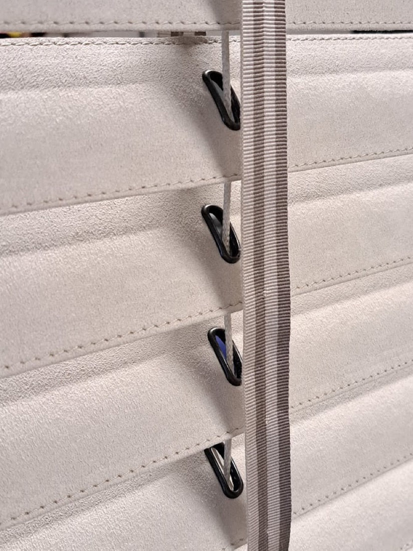 Close-up of La Nautica covered Venetian slats with stitching and tape detail
